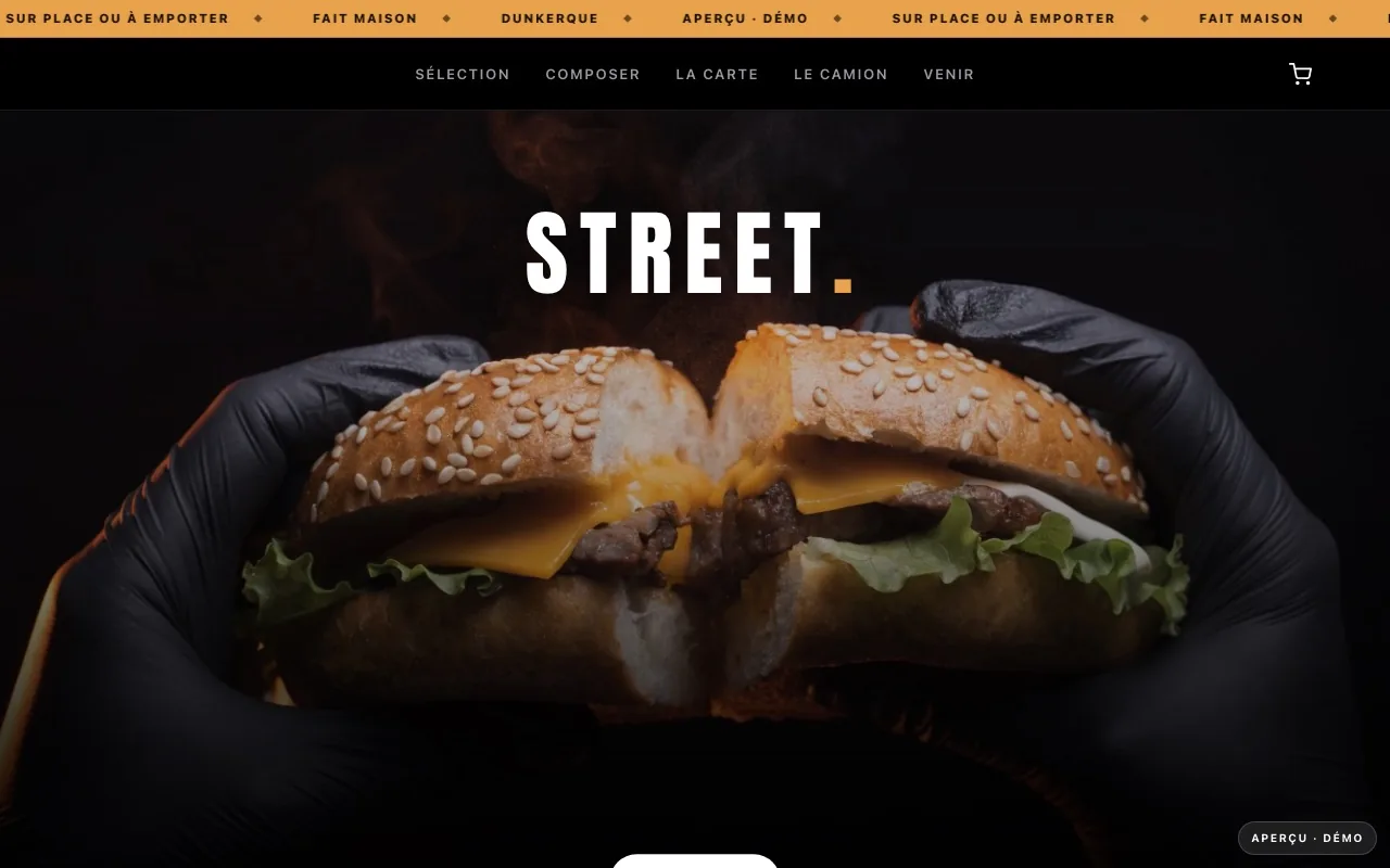Maquette de site premium pour un food truck street-food à Dunkerque : ambiance noire et orange, bagel gourmand tenu à deux mains